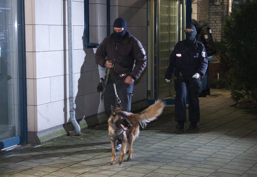Police officers with a dog arrive at a house on in Berlin on Thursday. Germany’s Federal Public Prosecutor’s Office has arrested four suspected Hamas members in Berlin and Rotterdam in the Netherlands. Photo: dpa Police officers with a dog arrive at a house on in Berlin on Thursday. Germany’s Federal Public Prosecutor’s Office has arrested four suspected Hamas members in Berlin and Rotterdam in the Netherlands. Photo: dpa