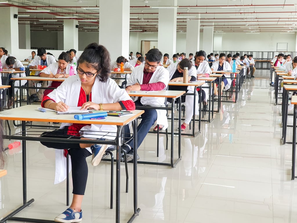 Medical students sit for an examination at a university hall in Kolkata, India. Photo: Shutterstock Medical students sit for an examination at a university hall in Kolkata, India. Photo: Shutterstock