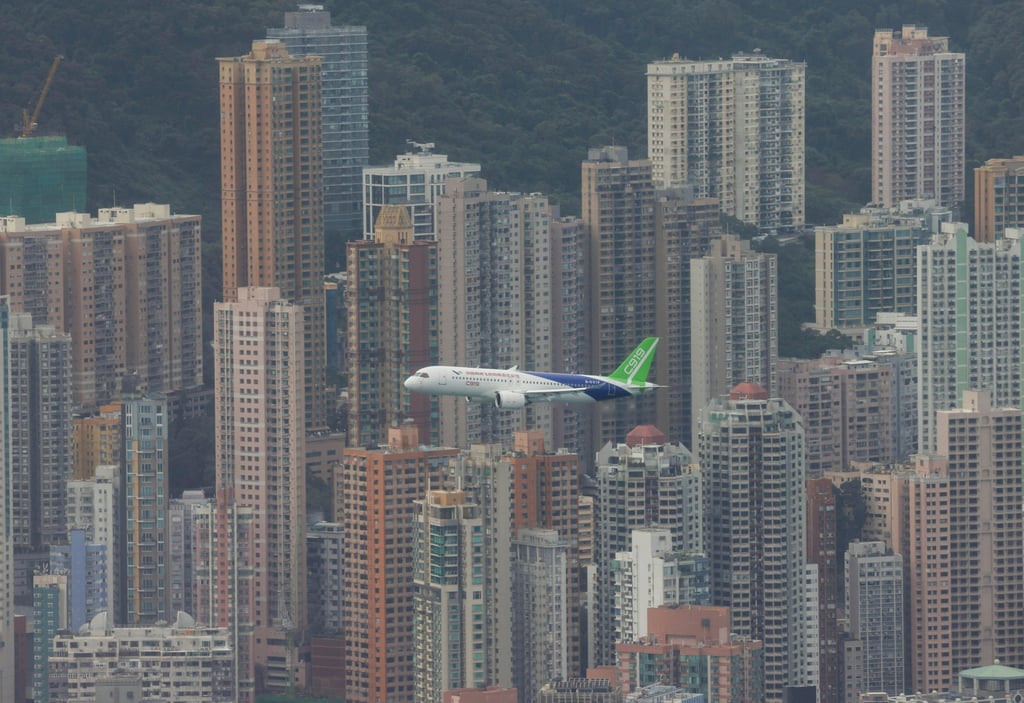 The C919 jet soars over Hong Kong’s harbour. Photo: Yik Yeung-man