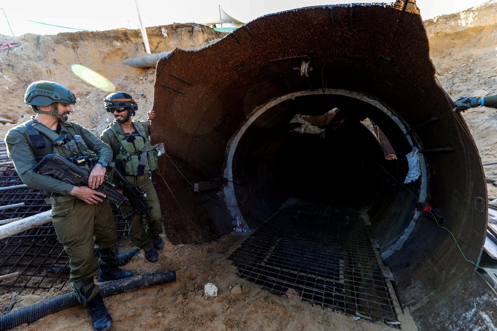 Israeli soldiers at an opening to the tunnel. Photo: Reuters