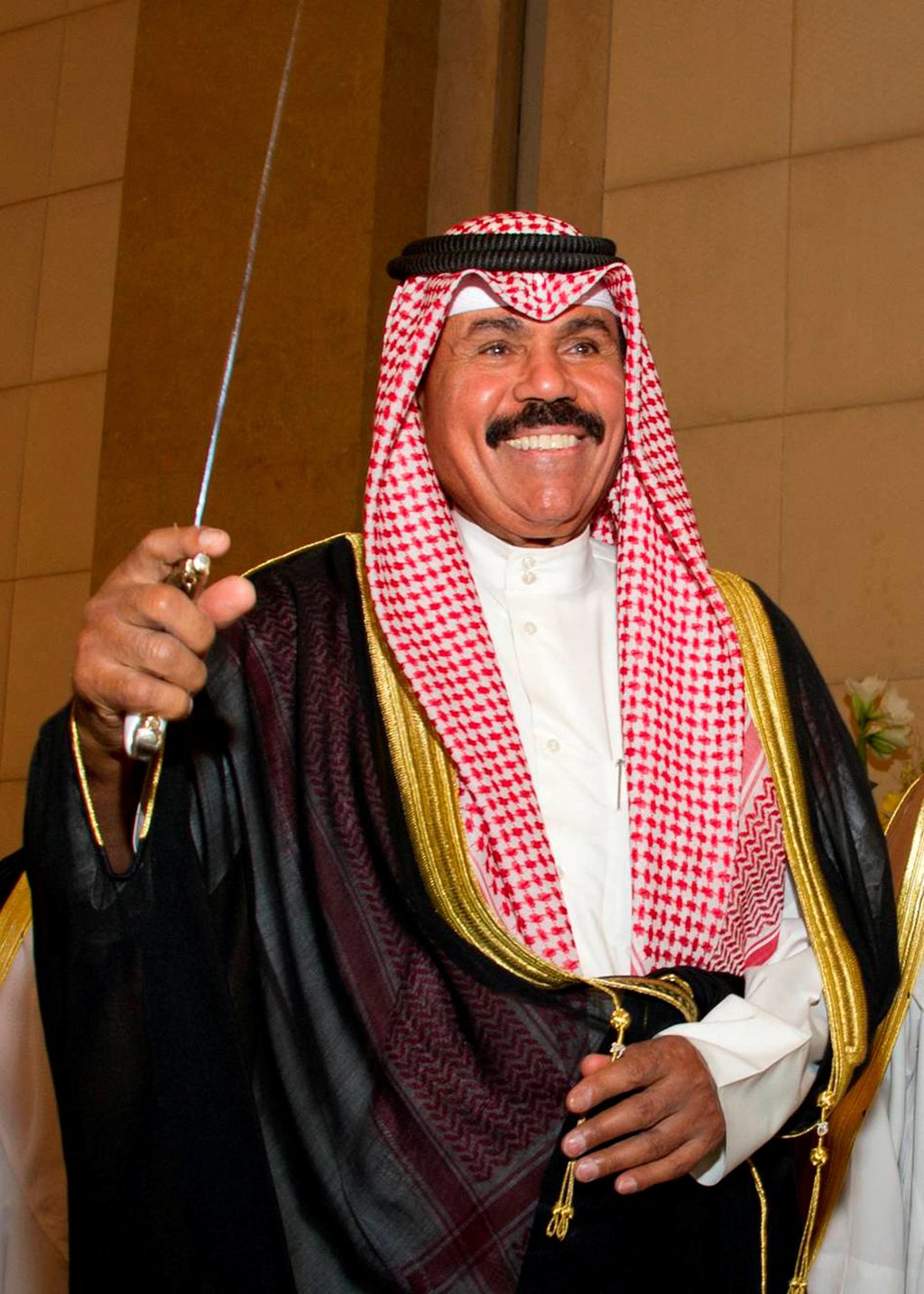 Sheikh Nawaf al-Ahmad al-Sabah dances with a sword at a Kuwaiti wedding reception in Kuwait City in 2012. Photo: Reuters Sheikh Nawaf al-Ahmad al-Sabah dances with a sword at a Kuwaiti wedding reception in Kuwait City in 2012. Photo: Reuters