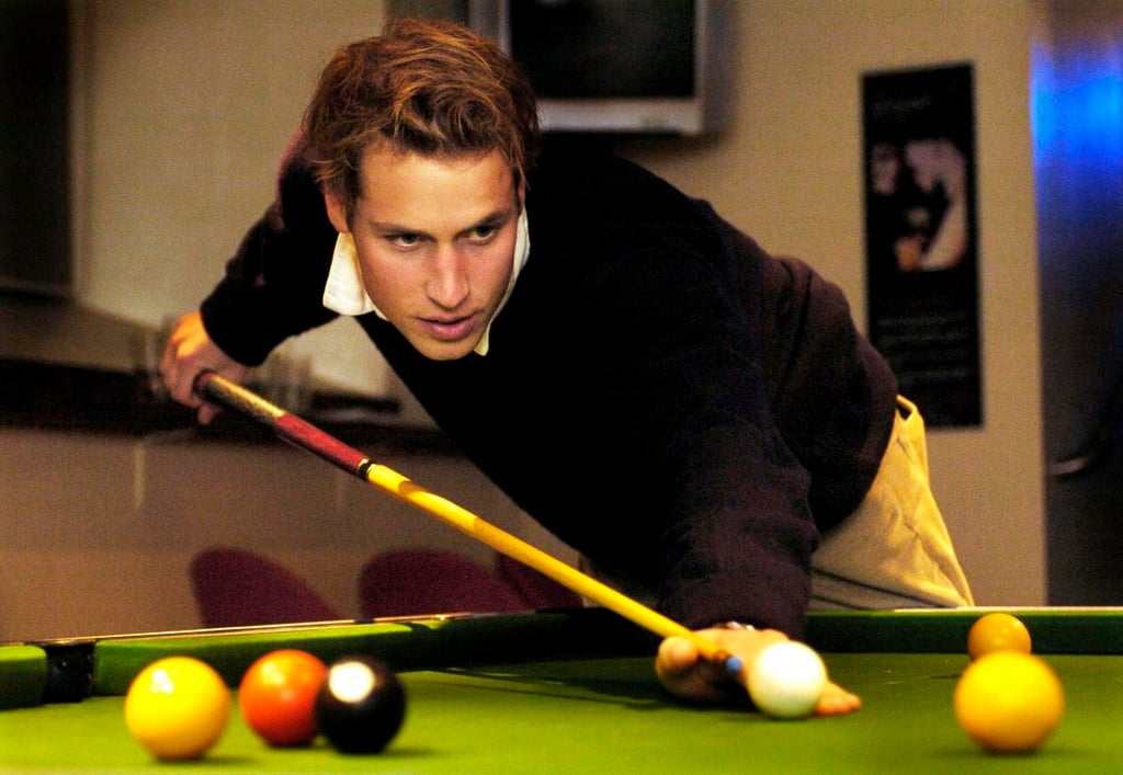 Prince William plays pool with friends at a bar in St Andrews where he was a student, in 2004. Photo: EPA