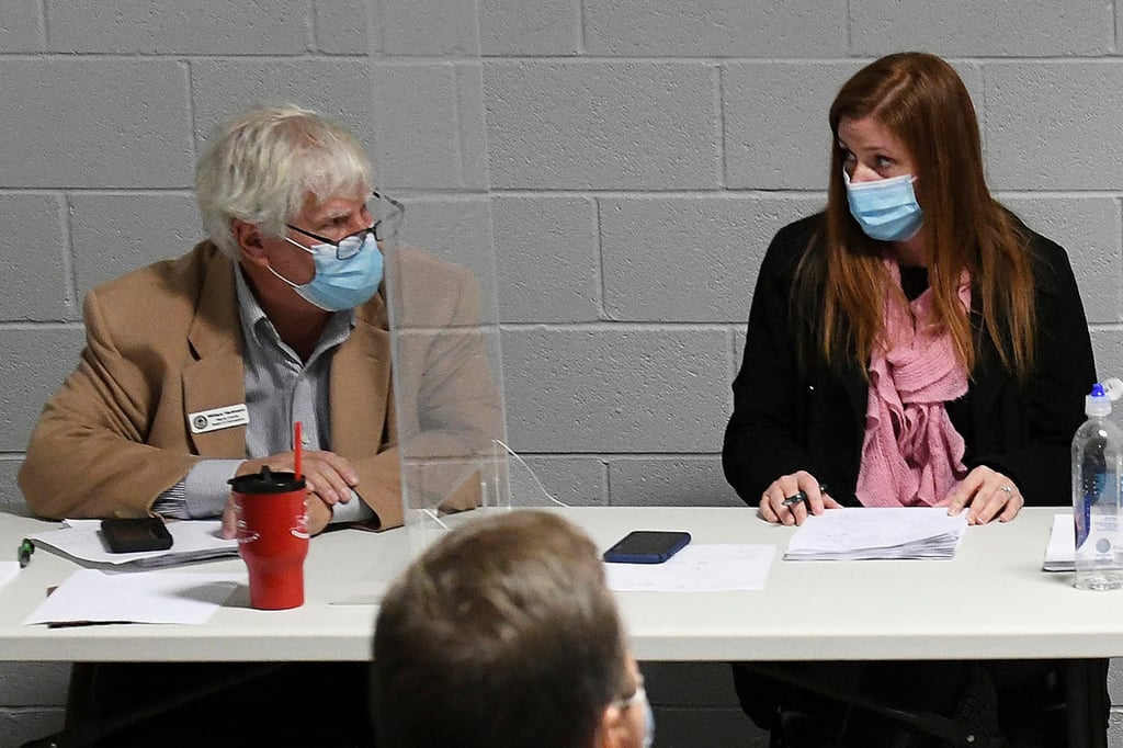 Wayne County Board of Canvassers Republican member William Hartmann and Republican chairwoman Monica Palmer attend a board meeting in Detroit in November 2020. Photo: Detroit News via AP Wayne County Board of Canvassers Republican member William Hartmann and Republican chairwoman Monica Palmer attend a board meeting in Detroit in November 2020. Photo: Detroit News via AP