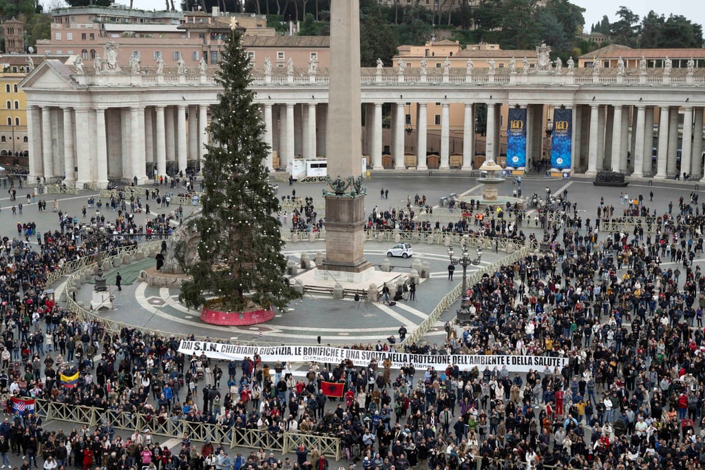Protesters display a banner as Pope Francis (not pictured) leads the Angelus prayer from his window in St Peter’s Square at the Vatican, Rome on Sunday. Photo: Vatican Media / ­Handout via Reuters