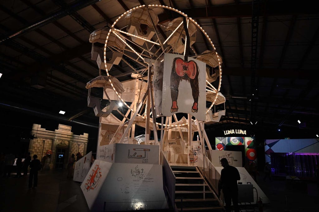 The Painted Ferris wheel by Jean-Michel Basquiat at “Luna Luna: Forgotten Fantasy”. Photo: AFP