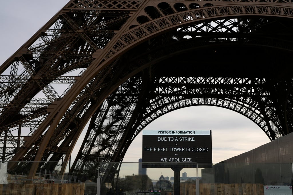 Tourists can still access the esplanade beneath the tower, but access to the landmark itself is closed, amid the strike. Photo: AP Tourists can still access the esplanade beneath the tower, but access to the landmark itself is closed, amid the strike. Photo: AP