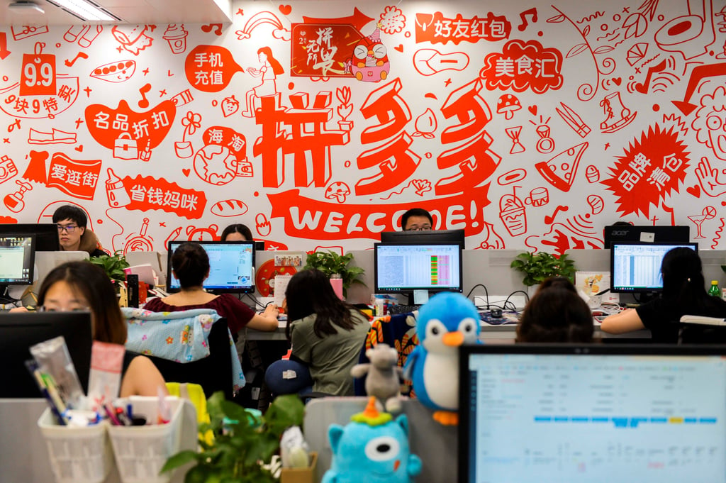 Pinduoduo employees are seen at their desks at the company’s offices in Shanghai on July 25, 2018. The budget online retailer started providing a “refund only” option to consumers in 2021. Photo: Reuters