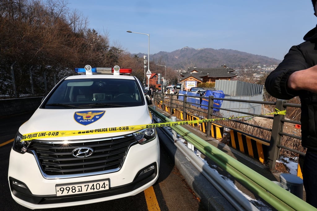 Police officers examine a scene where South Korean actor Lee Sun-kyun was found dead at a park in Seoul on Wednesday. Photo: Yonhap via Reuters