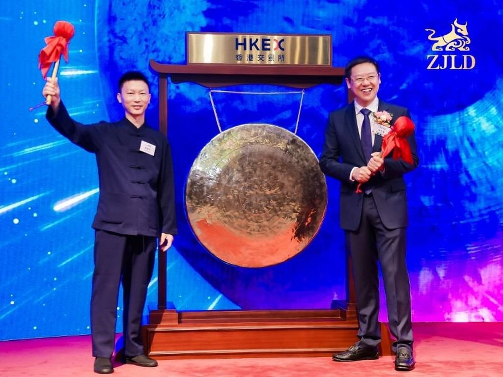ZJLD chairman Wu Xiangdong (right) and veteran employee Su Shuming at a gong-striking ceremony to mark the company’s trading debut in Hong Kong on April 27, 2023. Photo: Handout