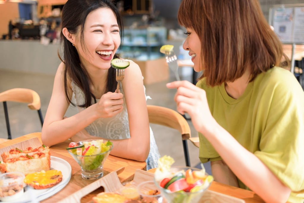 Two women enjoy a vegan meal. Veganuary, a challenge to avoid all animal products for a month, has had millions of participants since its launch in 2014. Photo: Shutterstock