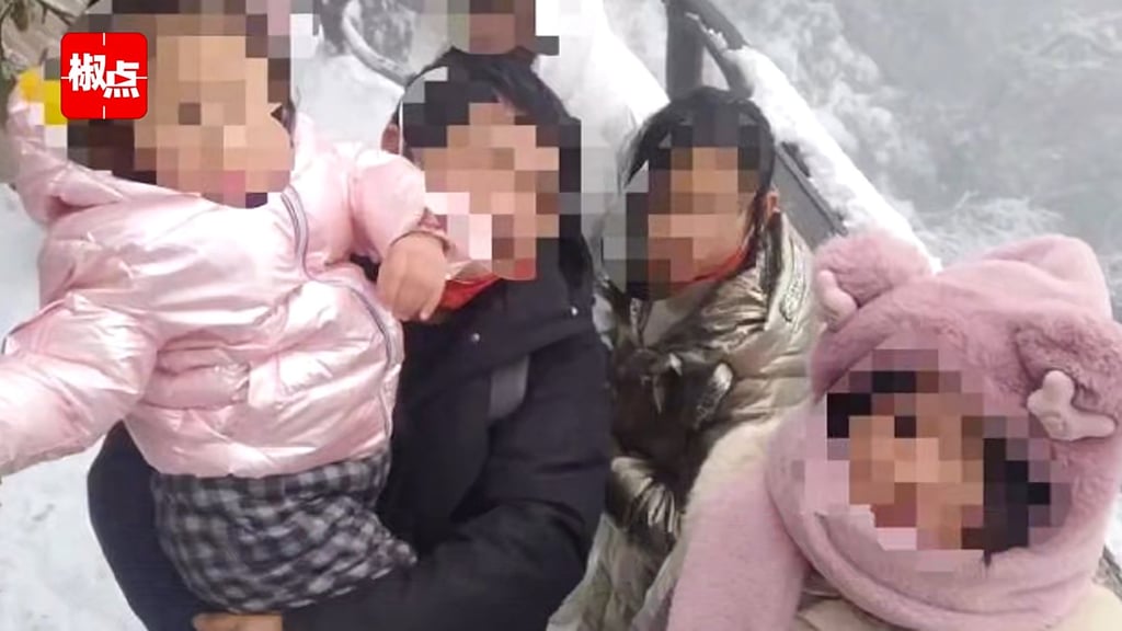 The wife in the case is pictured with two of her daughters. She has questioned the veracity of the DNA tests her husband had carried out Photo: Baidu