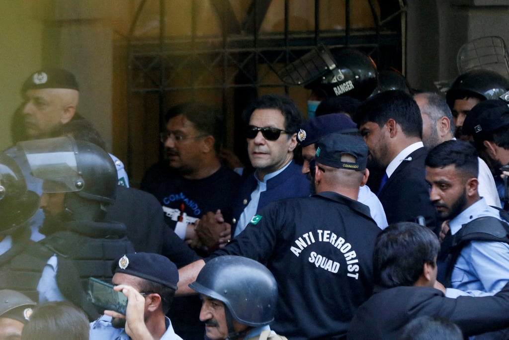Security officers escort Pakistan’s former prime minister Imran Khan as he appeared in Islamabad High Court on May 12. Photo: Reuters Security officers escort Pakistan’s former prime minister Imran Khan as he appeared in Islamabad High Court on May 12. Photo: Reuters