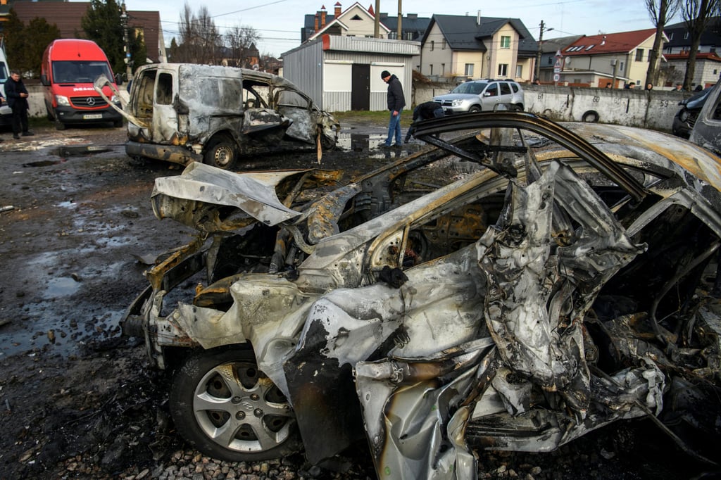 A man walks next to a car destroyed during a Russian missile and drone strike in Kyiv on December 29. Photo: Reuters A man walks next to a car destroyed during a Russian missile and drone strike in Kyiv on December 29. Photo: Reuters