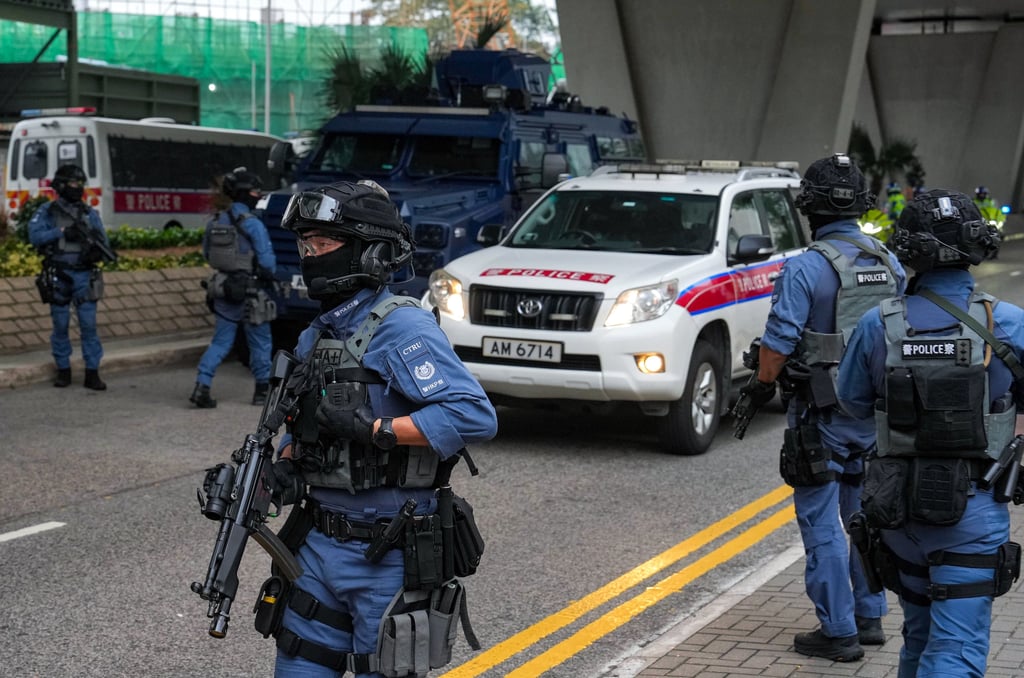 Armed officers outside West Kowloon Court. Police have been out in numbers for the opening days of the high-profile trial. Photo: Elson Li Armed officers outside West Kowloon Court. Police have been out in numbers for the opening days of the high-profile trial. Photo: Elson Li