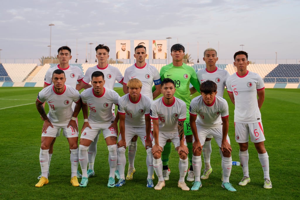 The Hong Kong team line up for a picture before the start of their game against China in Abu Dhabi. Photo: HKFA