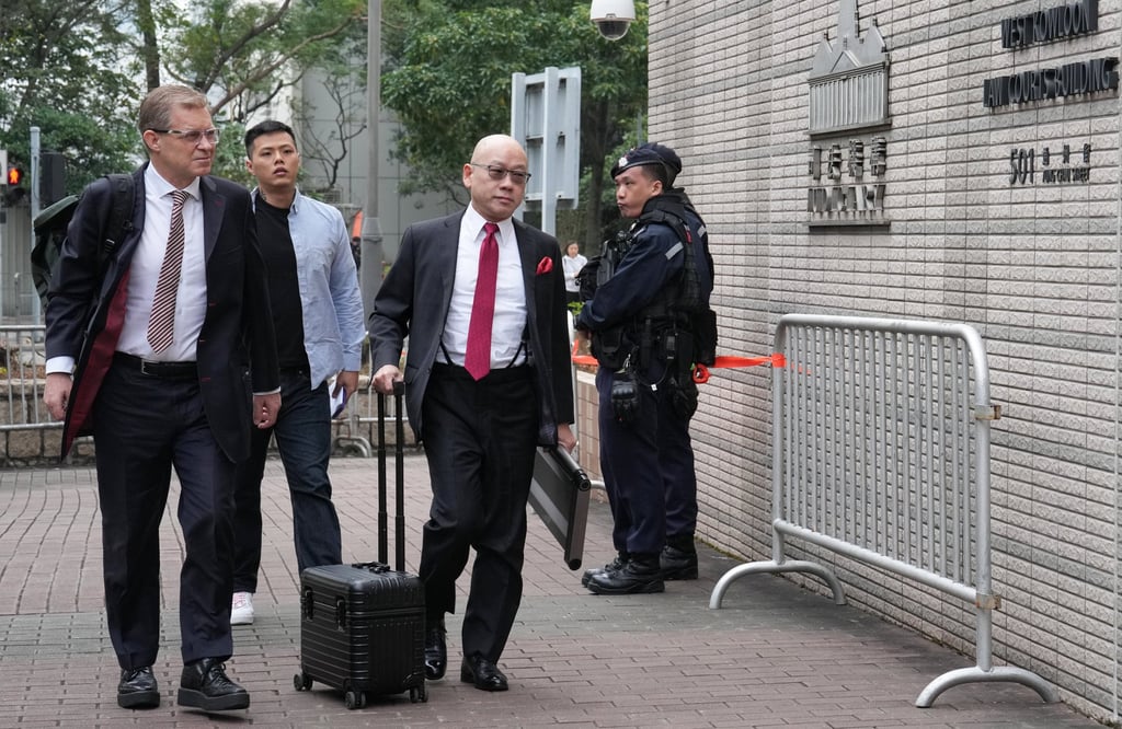 Member of Lai’s defence team outside West Kowloon Court on Tuesday. Photo: Elson Li