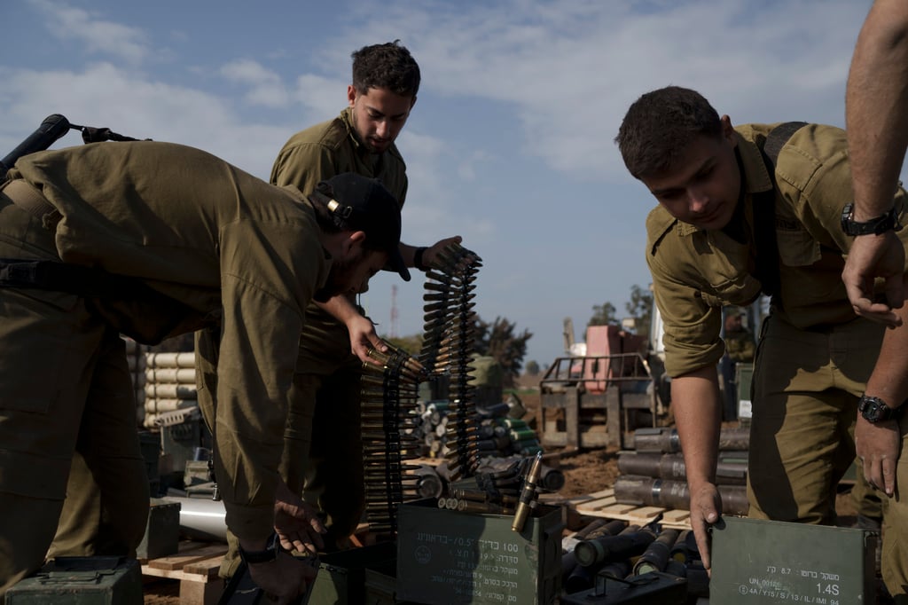 Israeli soldiers store ammunition in a staging area at the Israeli-Gaza border in southern Israel on Tuesday, The army said on Monday that several thousand troops would be taken out of Gaza in the coming weeks. Photo: AP