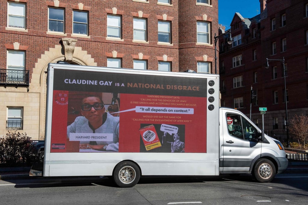 A truck with a sign calling the president of Harvard a disgrace, at Harvard University. Photo: AFP A truck with a sign calling the president of Harvard a disgrace, at Harvard University. Photo: AFP