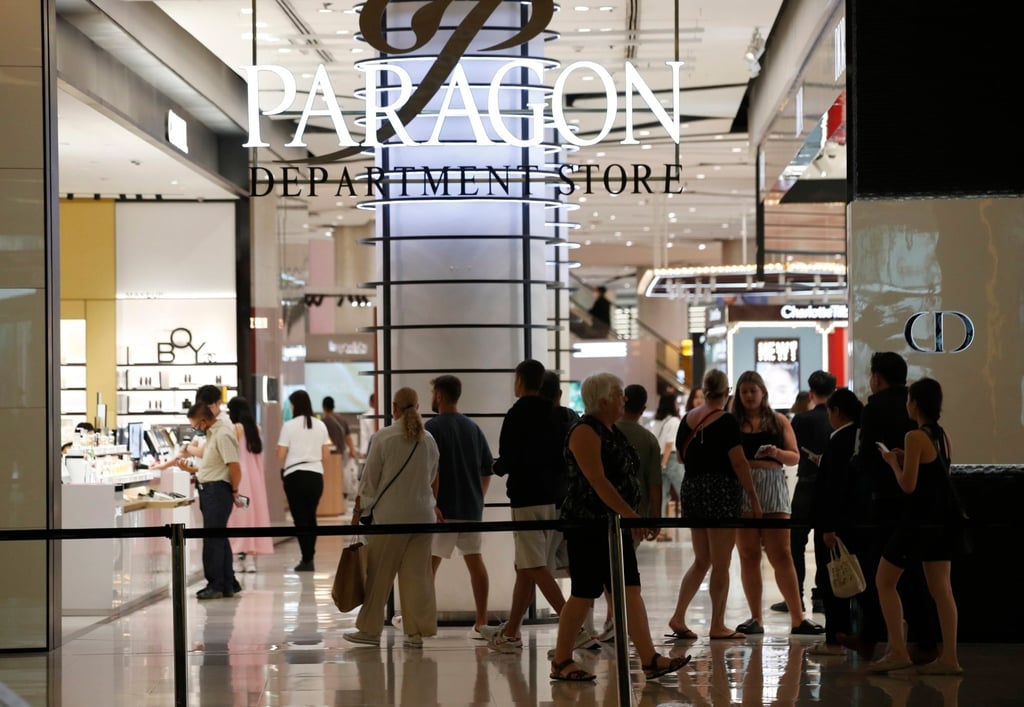 People shop a day after a gun shooting inside the Siam Paragon shopping mall in Bangkok. Photo: EPA-EFE