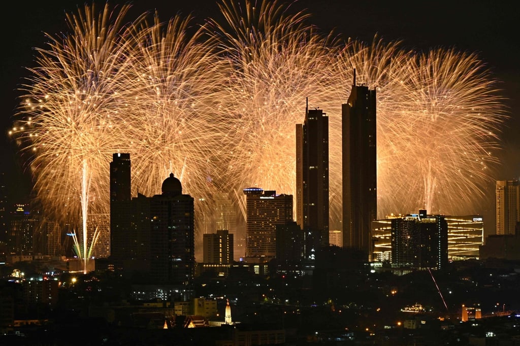 Fireworks explode along the Chao Phraya River during New Year’s Eve celebrations in Bangkok. The man’s extensive assets were spread across the Thai capital and the provinces of Trat, Chiang Rai and Chonburi, police said. Photo: AFP