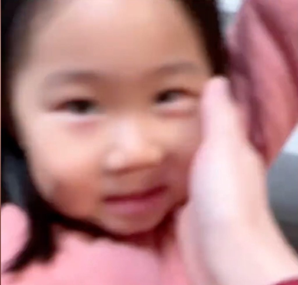 Little Niu’s mother caresses her daughter’s face after she made a touching speech on her birthday. Photo: Douyin