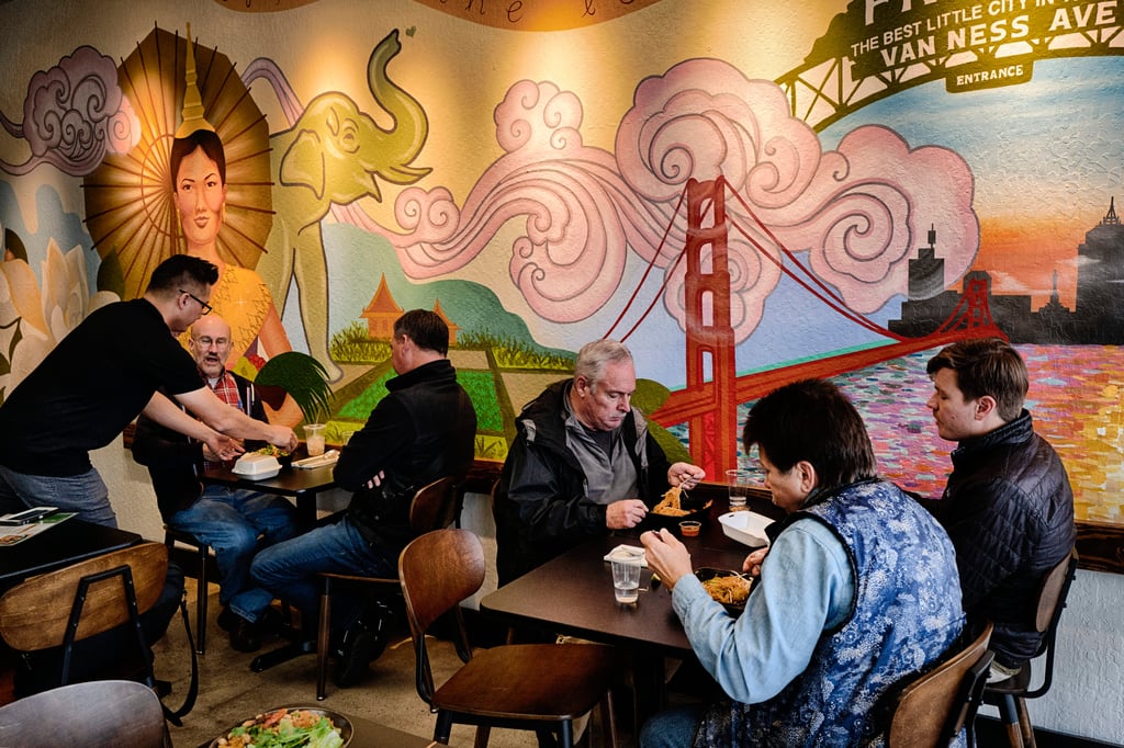 David Rasavong serves customers during the lunch hour rush in his restaurant Love & Thai in Fresno, California. Photo: AP David Rasavong serves customers during the lunch hour rush in his restaurant Love & Thai in Fresno, California. Photo: AP