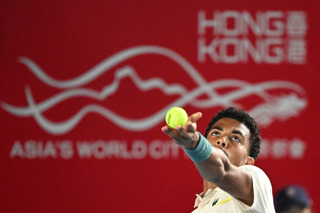 Arthur Fils serves to Andrey Rublev during their men’s quarter-final. Photo: AFP