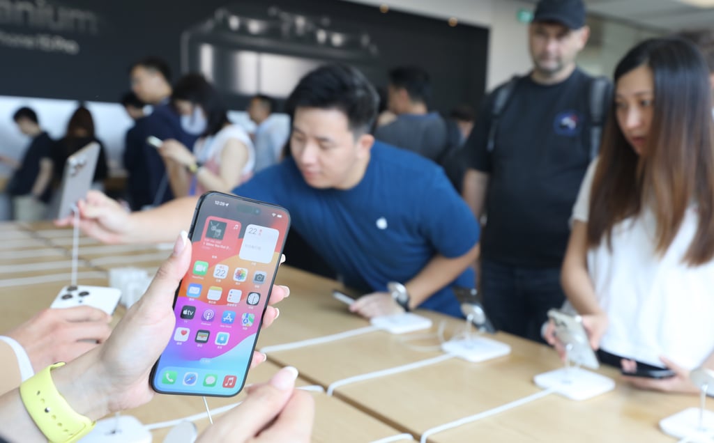 People check out the iPhone 15 models on display at the Apple Store inside the IFC Mall in Central on September 22, 2023. Photo: Xiaomei Chen