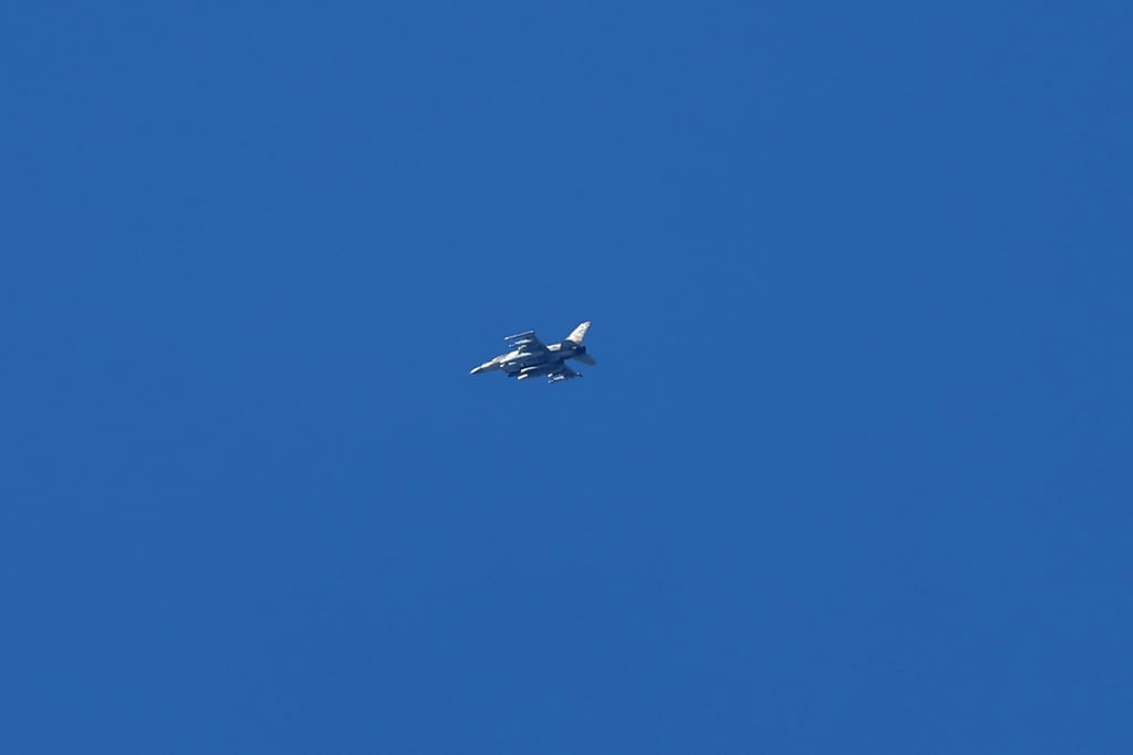 An Israeli fighter jet flies over an area near the Lebanon-Israel border, as seen from northern Israel on Saturday. Israel said it had struck terrorist targets in southern Lebanon. Photo: EPA-EFE