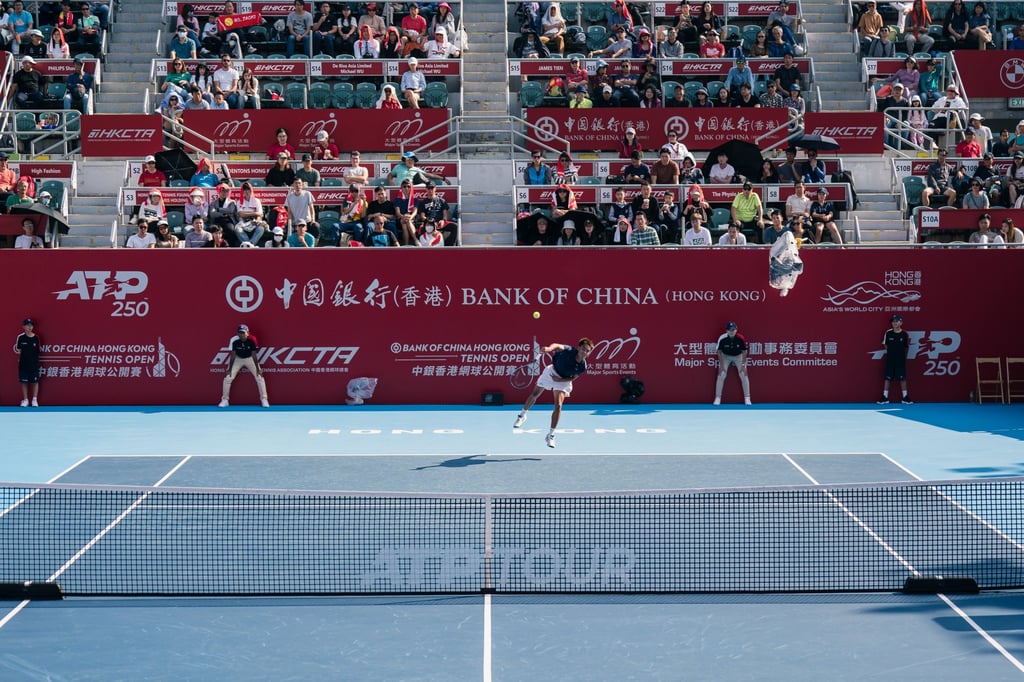 Spectators watch as Hong Kong’s Jack Wong serves during his singles qualifying match against Terence Atmane on the opening day of the Hong Kong Open at Victoria Park. Photo: HKCTA