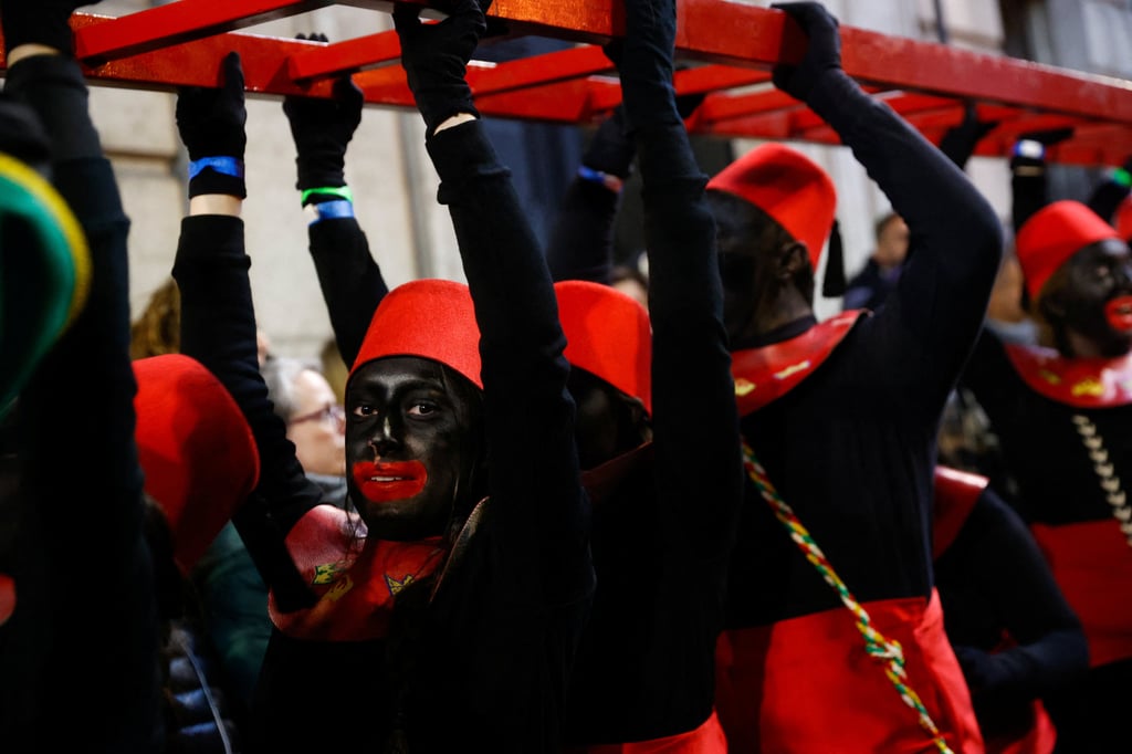 Participants dressed in costumes and wearing blackface take part in the annual Epiphany eve parade of the Three Kings, in Alcoy, Spain, on Friday. Photo: Reuters