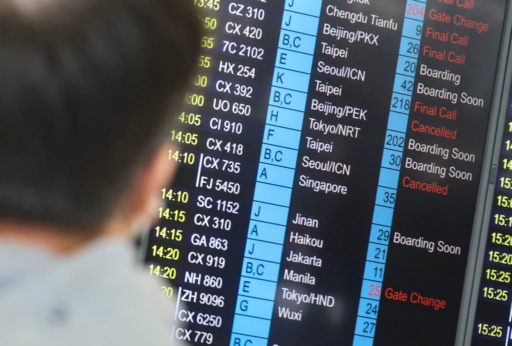 Cancelled Cathay Pacific flights are shown on the departures board at Hong Kong International Airport. Photo: Edmond So