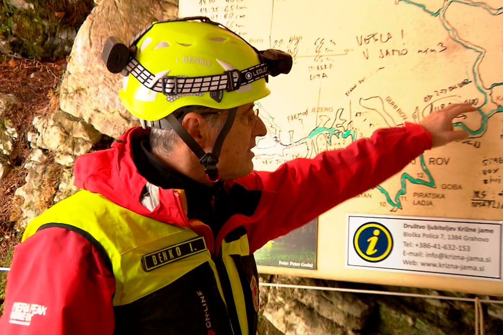aveA rescuer inspects the map of Krizna Jama cave near Grahovo, Slovenia on Sunday, Photo: Pop TV via AP aveA rescuer inspects the map of Krizna Jama cave near Grahovo, Slovenia on Sunday, Photo: Pop TV via AP