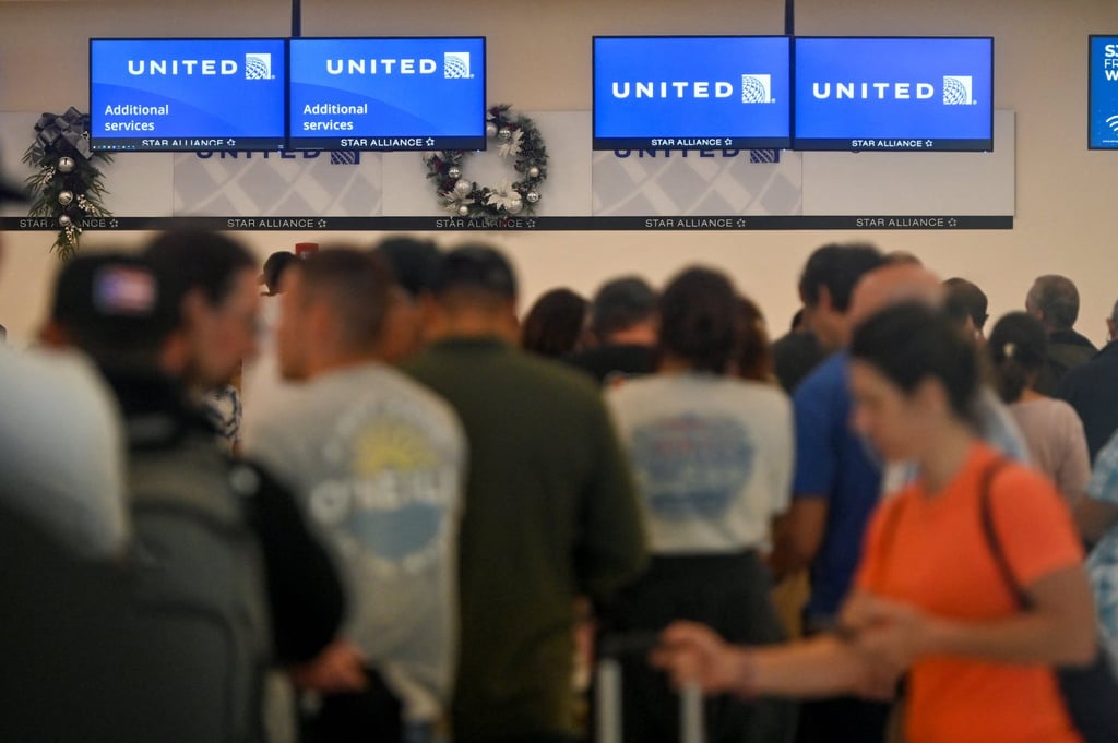 Passengers at Luis Munoz Marin International Airport in San Juan, Puerto Rico try to rebook their tickets from cancelled United Airlines flights on Sunday. Photo: Reuters Passengers at Luis Munoz Marin International Airport in San Juan, Puerto Rico try to rebook their tickets from cancelled United Airlines flights on Sunday. Photo: Reuters
