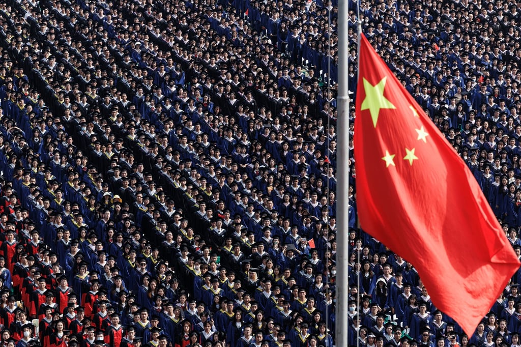 Students from Wuhan University watch the flag raising ceremony during a graduation event on June 20, 2023. Photo: SOPA Images via ZUMA Press Wire/dpa