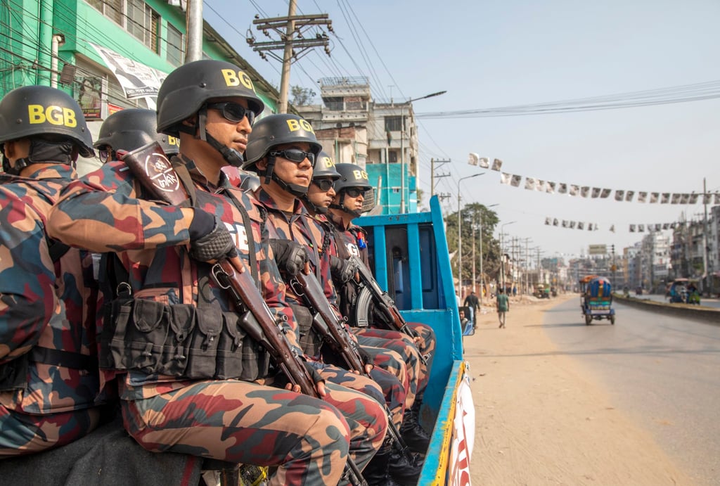 Border guards patrol inat Keraniganj Upazila, on the outskirts of Dhaka, during Bangladesh’s 12th national general election on Sunday. Photo: EPA-EFE Border guards patrol inat Keraniganj Upazila, on the outskirts of Dhaka, during Bangladesh’s 12th national general election on Sunday. Photo: EPA-EFE