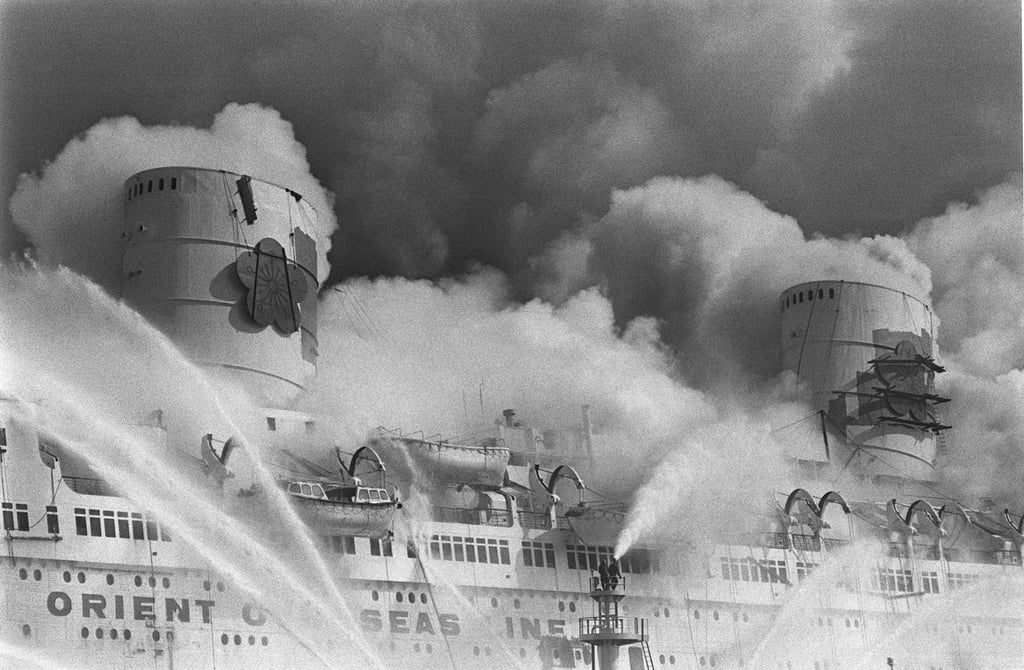 Fireboats spray jets of water on the burning Seawise University in a bid to quench the flames on January 9, 1972. Photo: R Tam Fireboats spray jets of water on the burning Seawise University in a bid to quench the flames on January 9, 1972. Photo: R Tam