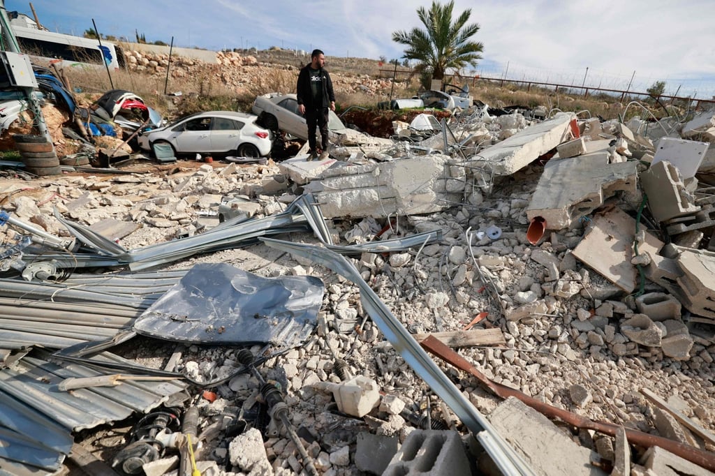 Palestinians inspect the remains of a building demolished by Israeli forces in the occupied West Bank last month. Photo: AFP