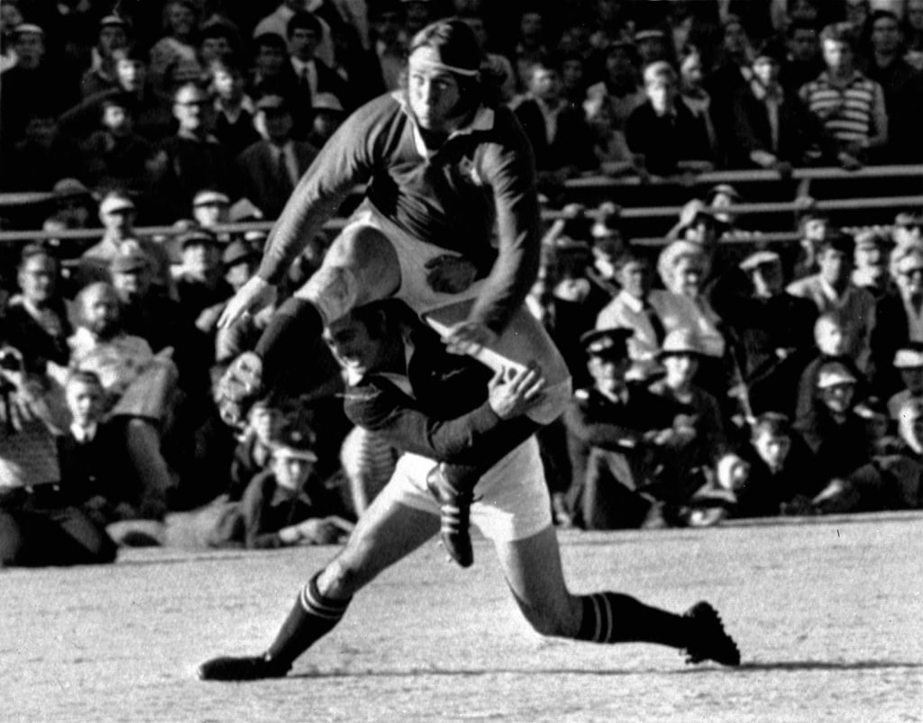 British Lions winger JPR Williams gets his foot to the ball despite the efforts of Springbok Chris Pope in the test match at Loftus Versfeld, Pretoria, on June 22, 1974. Photo: AP British Lions winger JPR Williams gets his foot to the ball despite the efforts of Springbok Chris Pope in the test match at Loftus Versfeld, Pretoria, on June 22, 1974. Photo: AP