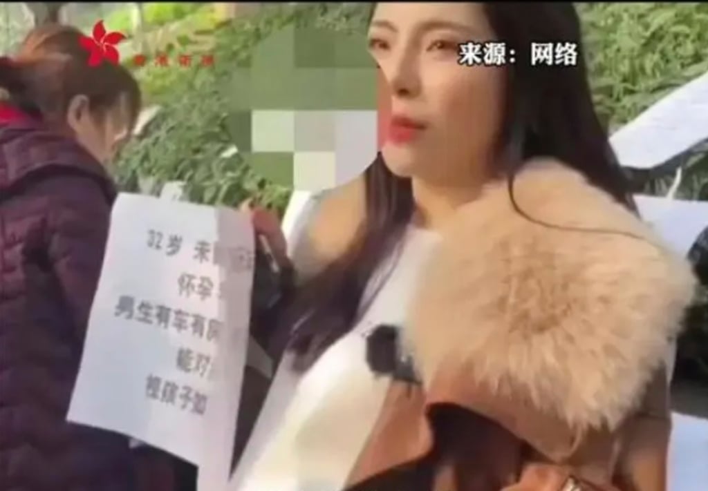 The woman holds up a piece of paper listing her “requirements” at the matchmaking event. Photo: Baidu