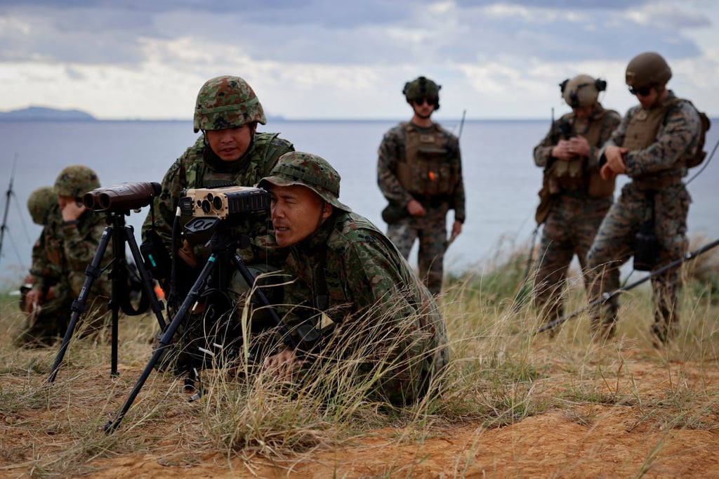 Commander Shingo Nashinoki and soldiers of the Japanese Ground Self-Defence Force’s Amphibious Rapid Deployment Brigade take part in a military drill on the uninhabited Irisuna island close to Okinawa in November 2023. Photo: Reuters