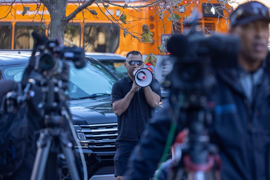 A Trump supporter taunts members of the news media with a loudhailer outside the Los Angeles courthouse where Hunter Biden appeared for arraignment on tax charges on Thursday. Photo: AFP