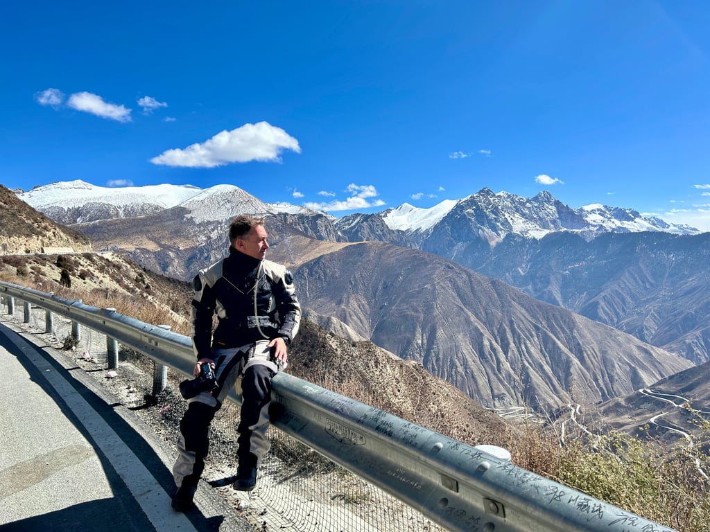 Writer Ian Neubauer takes a moment to reflect on the “roof of the world”, at Tibet’s Nujiang Pass, which reaches 5,218 metres above sea level. Photo: Ian Neubauer Writer Ian Neubauer takes a moment to reflect on the “roof of the world”, at Tibet’s Nujiang Pass, which reaches 5,218 metres above sea level. Photo: Ian Neubauer