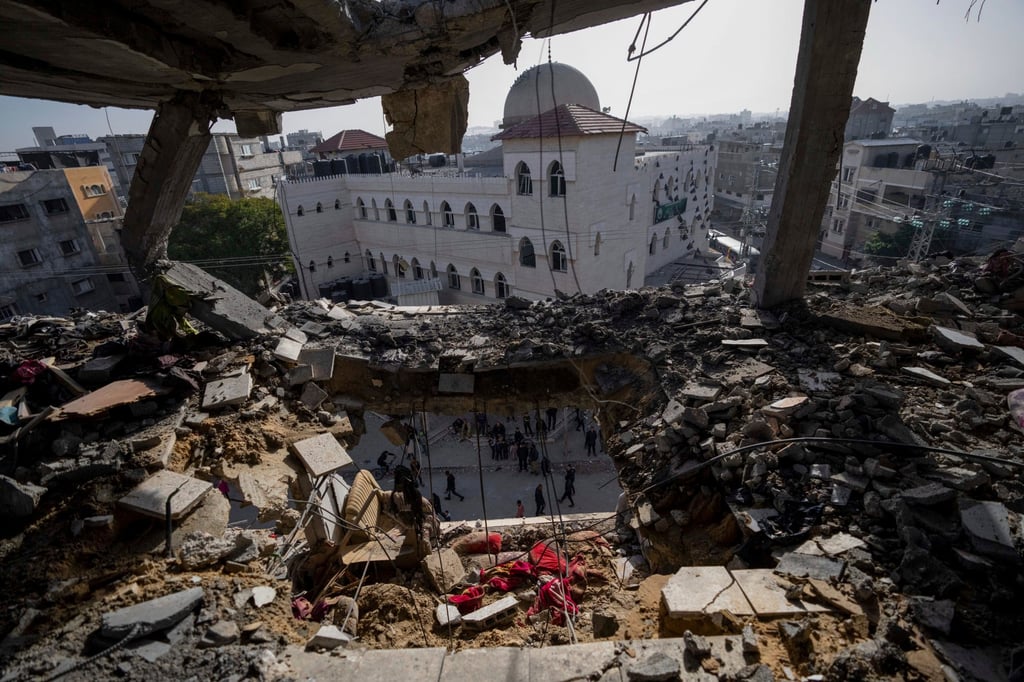 Palestinians look at a damaged residential building after an Israeli strike in Rafah, in the southern Gaza Strip on Wednesday. Photo: AP