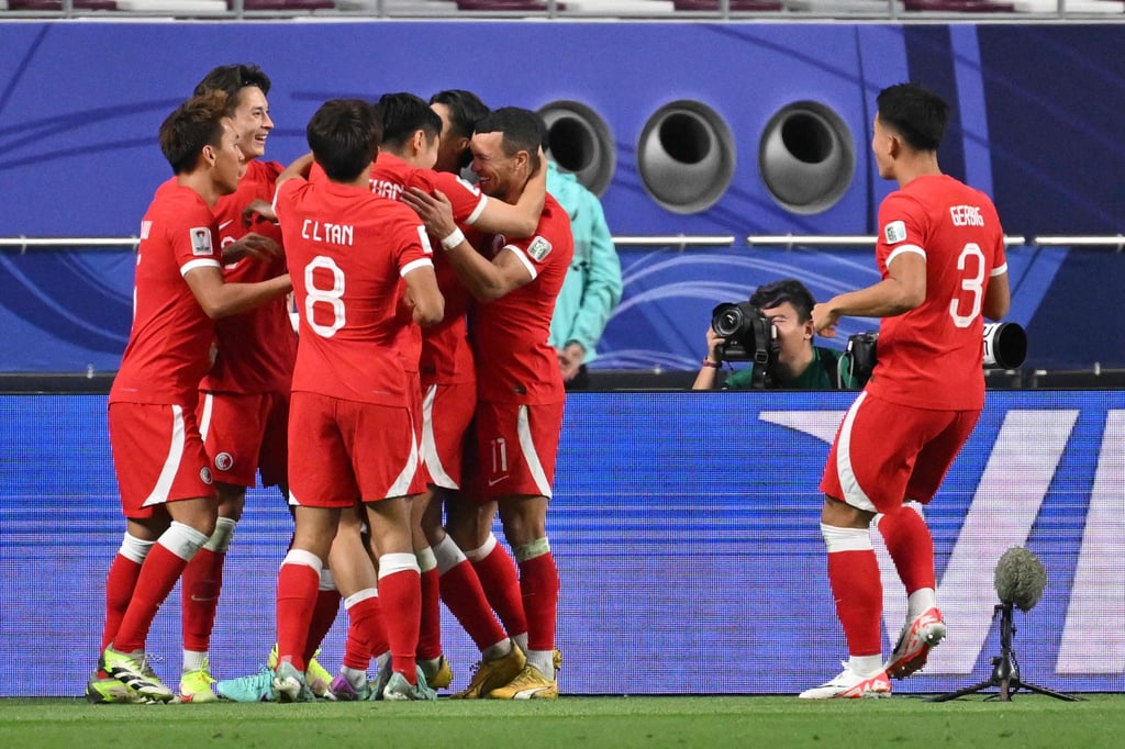 Hong Kong players savour the moment after Philip Chan’s goal drew them level on Sunday. Photo: AFP Hong Kong players savour the moment after Philip Chan’s goal drew them level on Sunday. Photo: AFP