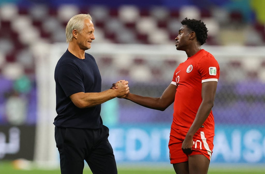 Michael Udebuluzor (right) was brought in by Hong Kong coach Jorn Andersen but had roots in the city. Photo: Reuters Michael Udebuluzor (right) was brought in by Hong Kong coach Jorn Andersen but had roots in the city. Photo: Reuters