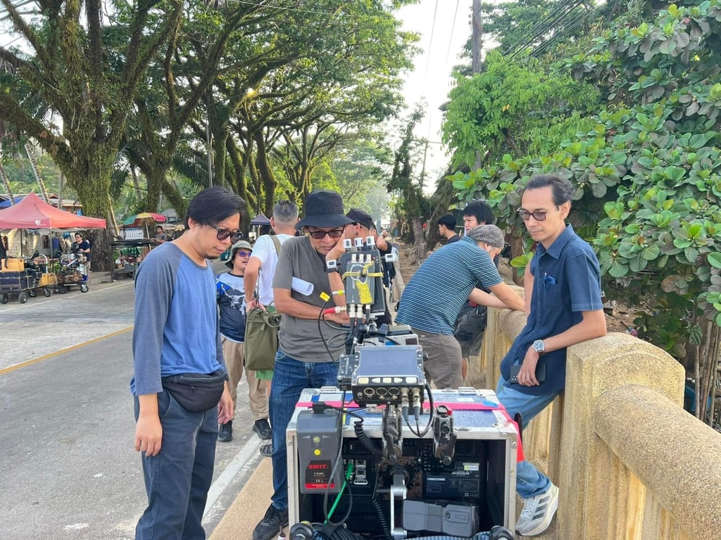 Panu Aree (centre) and Kong Rithdee (right) on the set of “The Cursed Land”. Photo: Courtesy of Panu Aree/Neramitnung Film