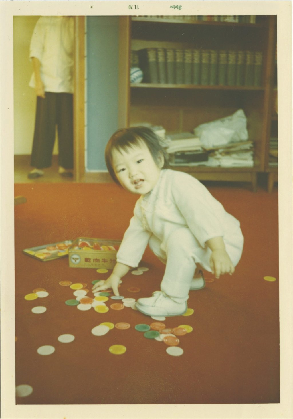 Mak (left) looks on as Tong plays on the floor. Earlier photos of Mak with the Tong family often show her off to the side or in the background, but as time goes on, she increasingly appears in the centre with other family members. Photo: Courtesy of Kurt Tong Mak (left) looks on as Tong plays on the floor. Earlier photos of Mak with the Tong family often show her off to the side or in the background, but as time goes on, she increasingly appears in the centre with other family members. Photo: Courtesy of Kurt Tong