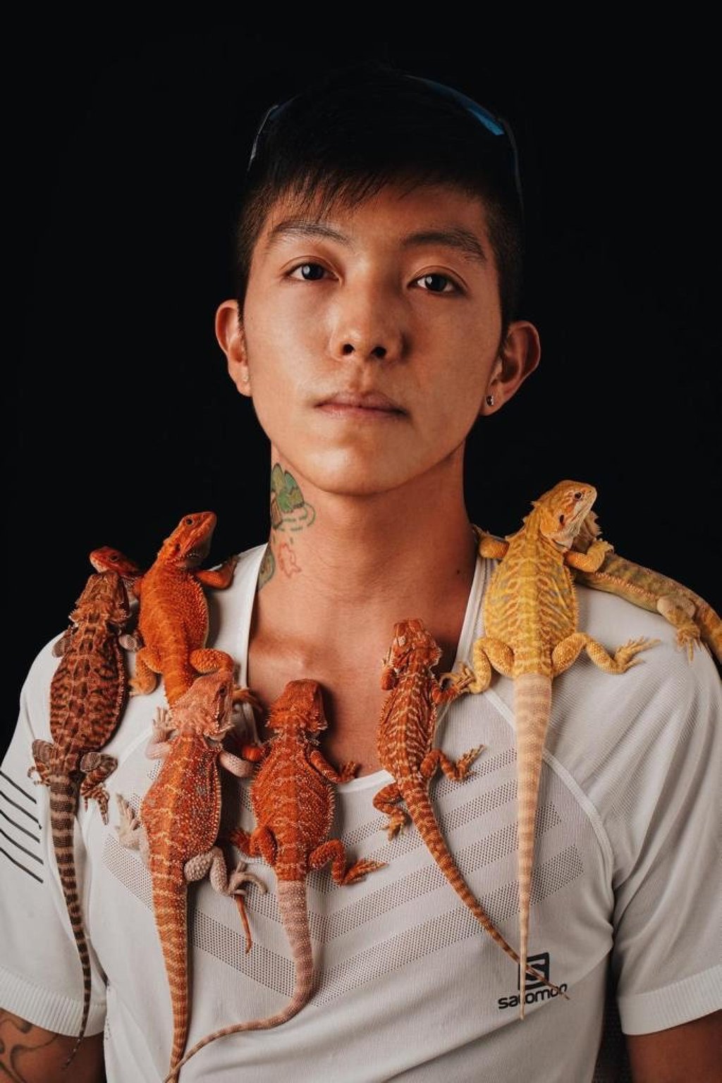 Liu Fo-lok with some of the bearded dragons he has been breeding and selling to fund his bid to finish the Hong Kong Four Trails Ultra Challenge. Photo: Liu Fo-lok