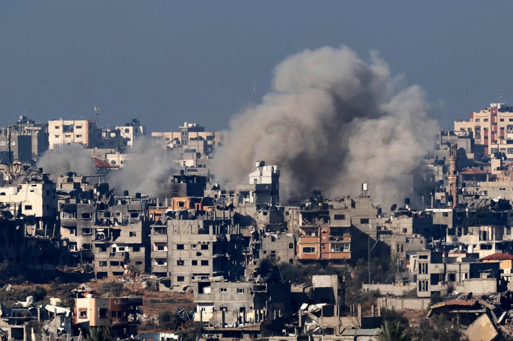 A picture taken from southern Israel on the border with the Gaza Strip shows smoke billowing over the Palestinian territory during Israeli bombardment on Friday, amid ongoing battles between Israel and the militant group Hamas. Photo: AFP